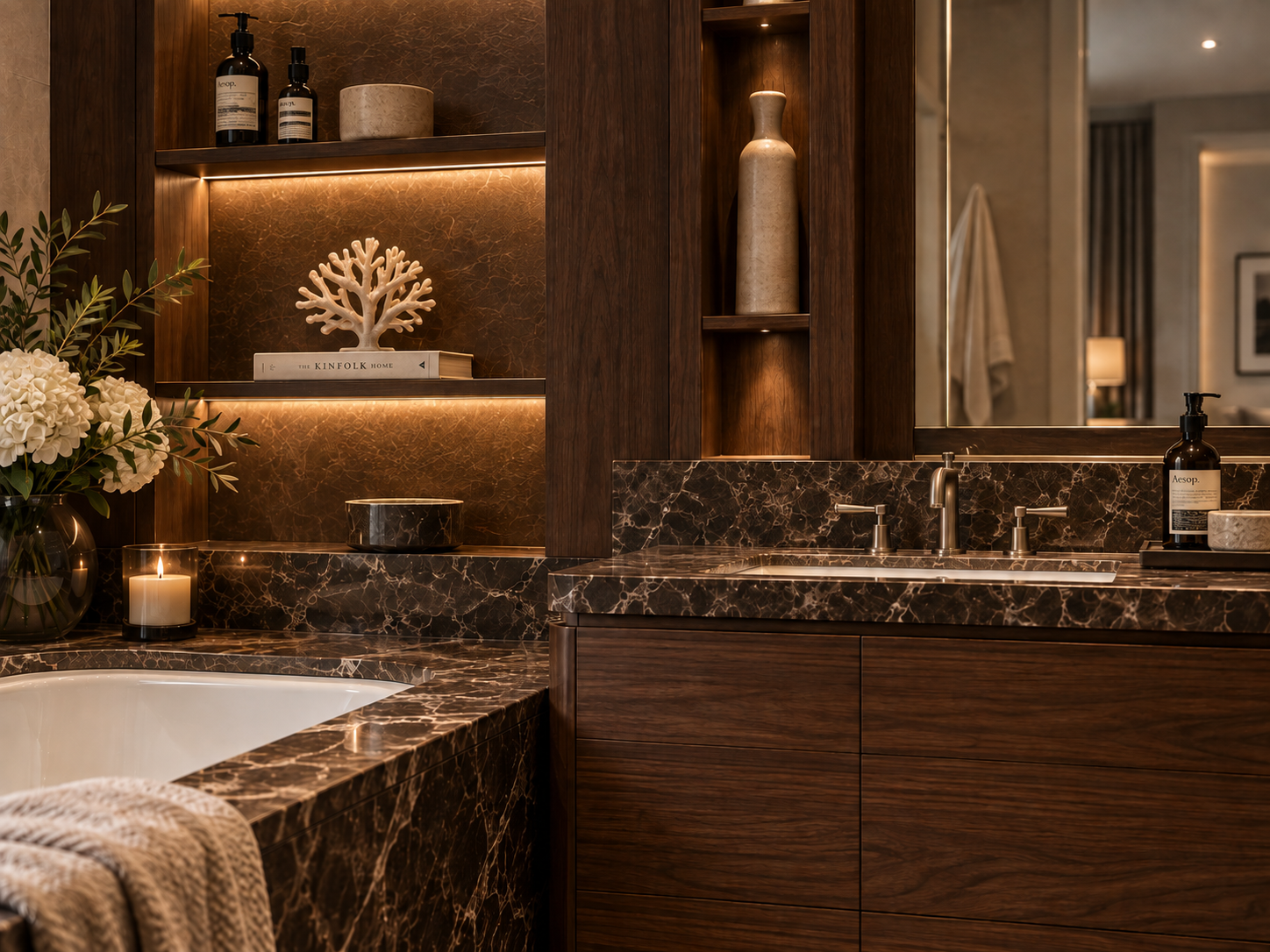 Close view of walnut joinery, dark veined stone, bronze fittings and illuminated reeded-glass cabinetry — Palace Court, London